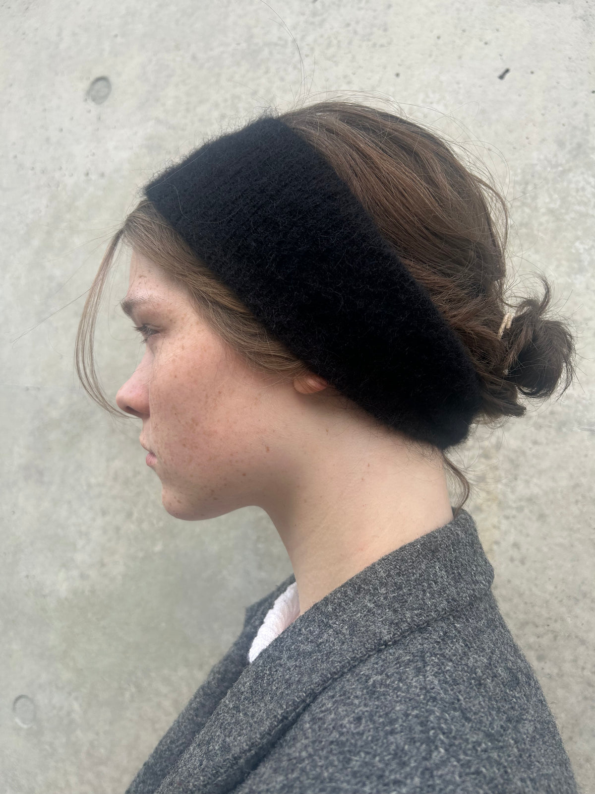 A soft and lightweight unisex headband knitted from alpaka wool .
