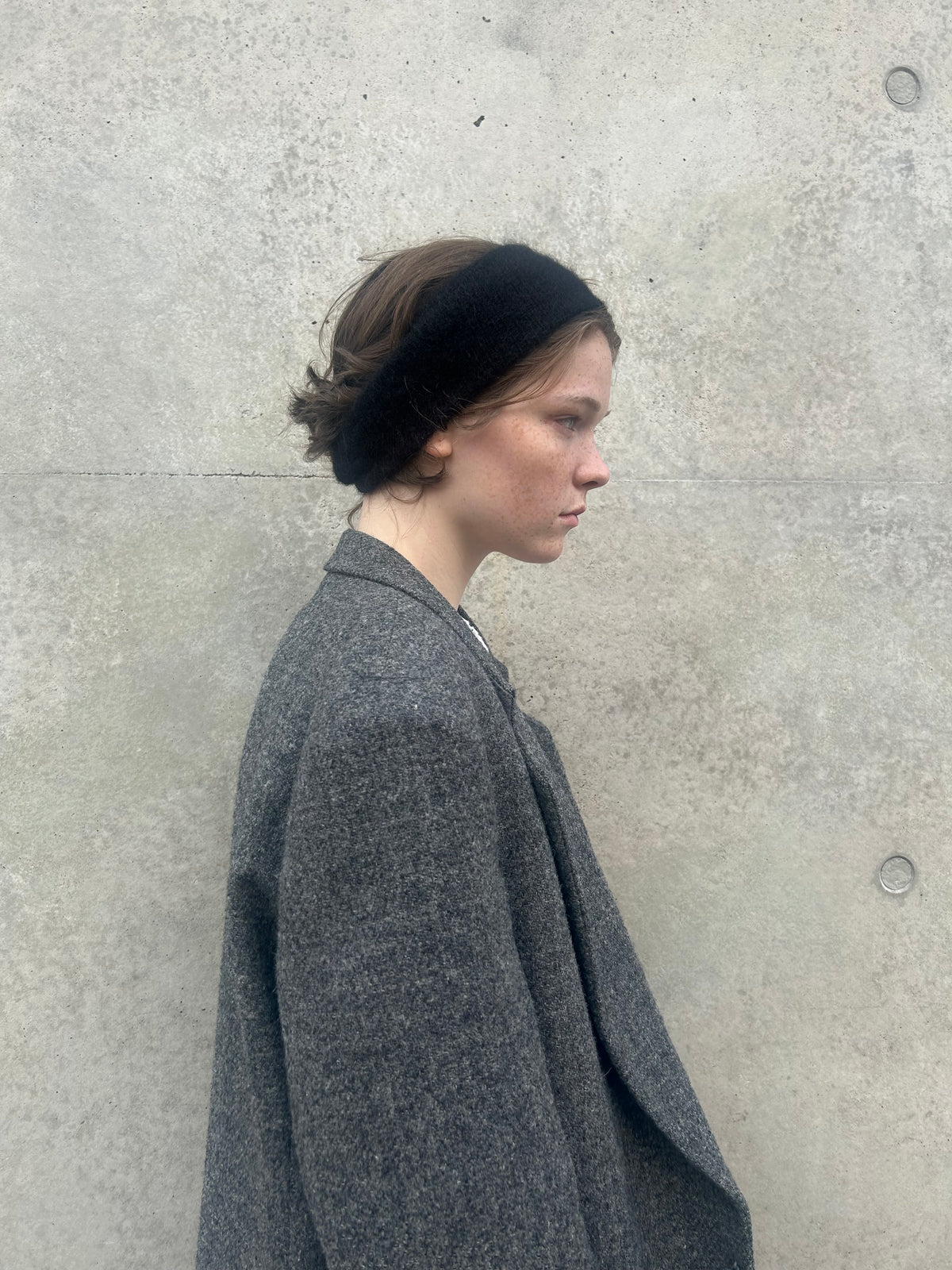 A soft and lightweight unisex headband knitted from alpaka wool .