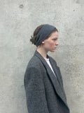 A soft and lightweight unisex headband knitted from merino wool.
