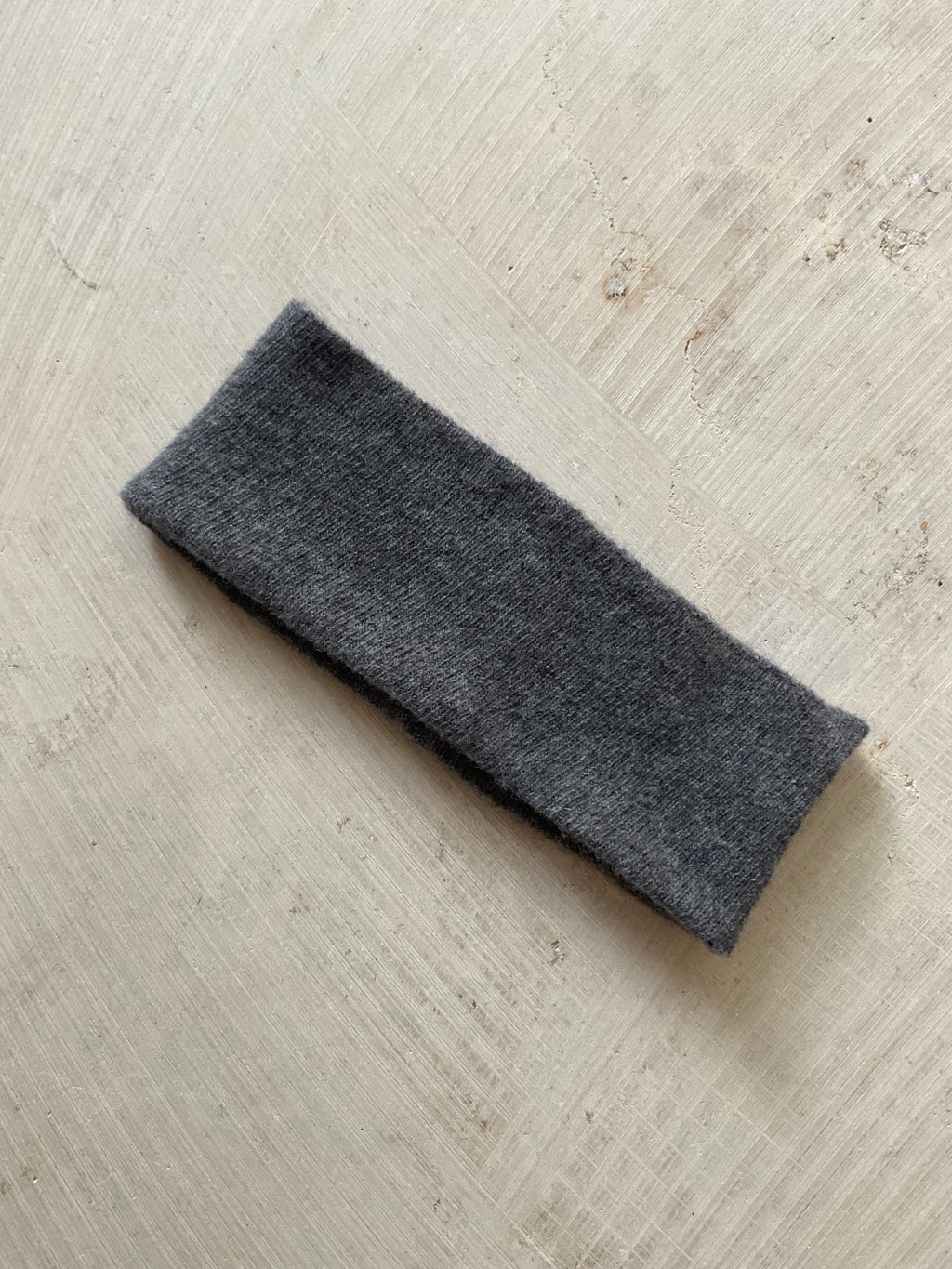 A soft and lightweight unisex headband knitted from merino wool.