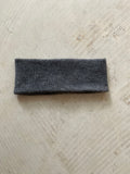 A soft and lightweight unisex headband knitted from merino wool.