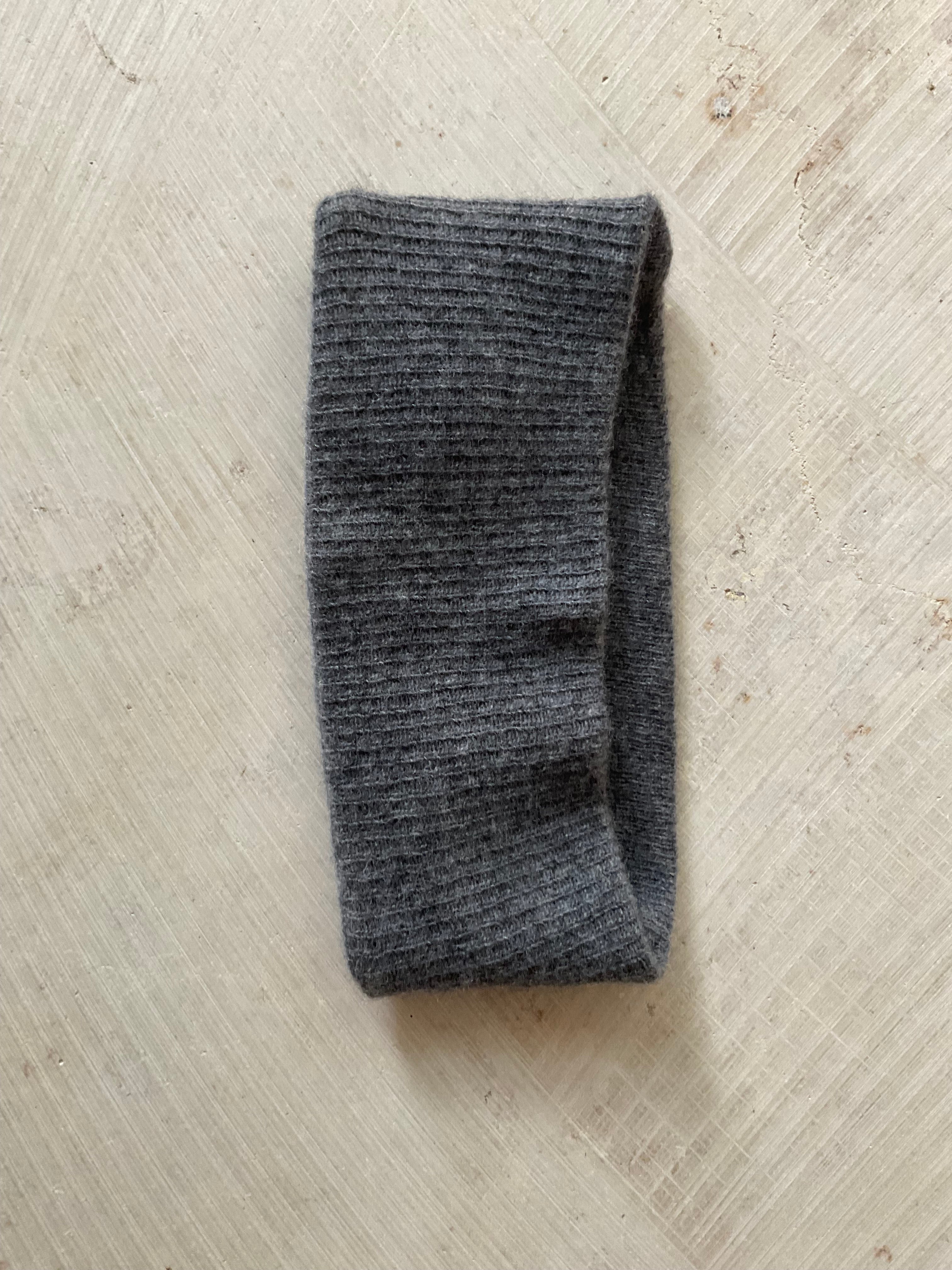 A soft and lightweight unisex headband knitted from merino wool.