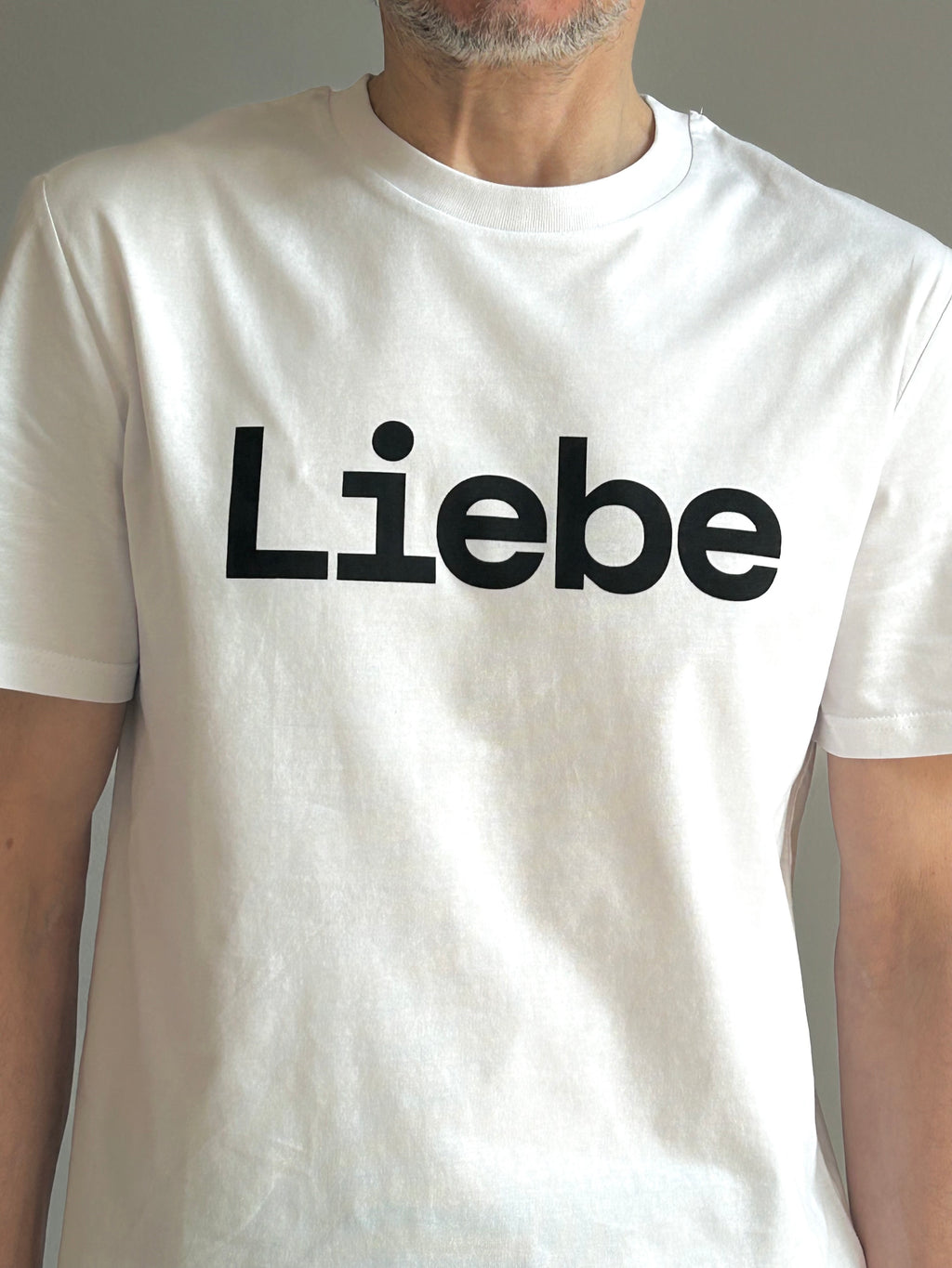 AEM  tshirt LIEBE white with black letters
