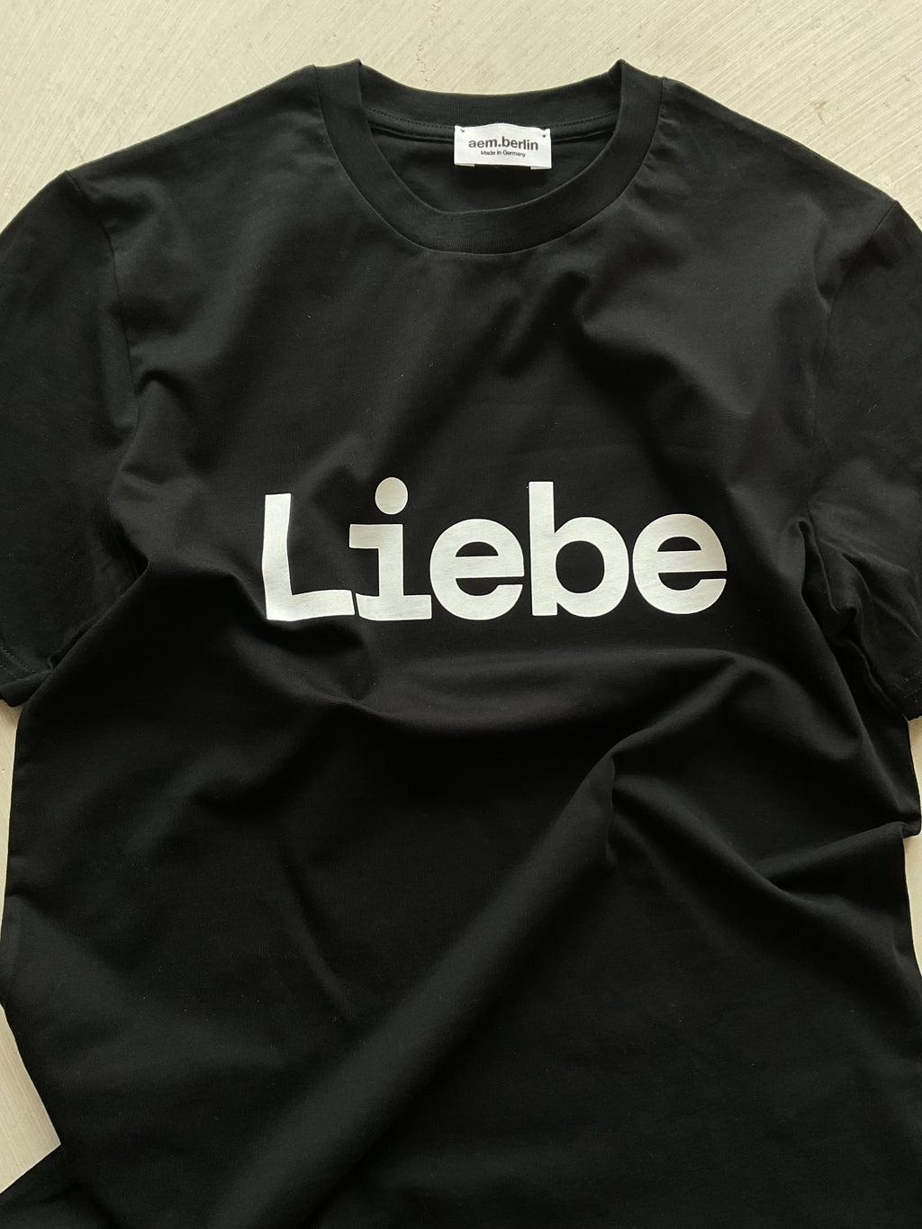 AEM  tshirt LIEBE black with white letters