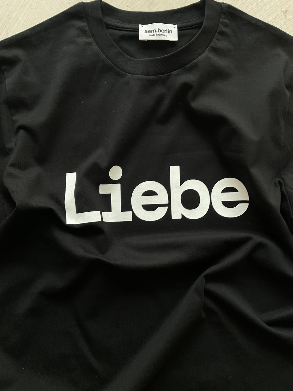 AEM  tshirt LIEBE black with white letters